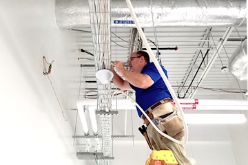 RSRF Engineer Installing DAS Antenna